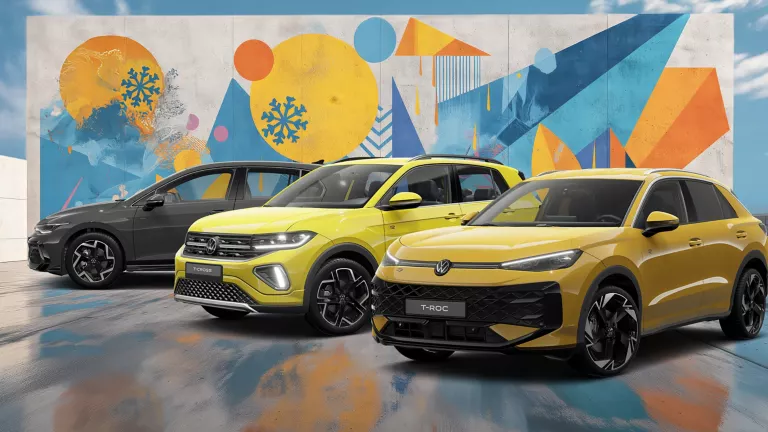 Drei VW-Modelle vor einer Wand mit winterlich, farbenfrohem, geometrischem Street-Art-Graffiti.