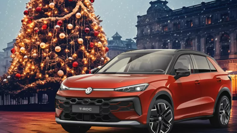 Ein gelber VW T-Roc R-Line und ein roter VW T-Roc Style stehen nebeneinander vor einem modernen Gebäude.