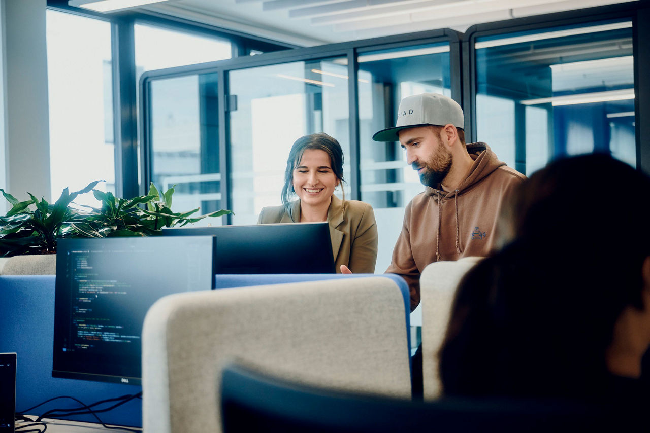 three people working in an office