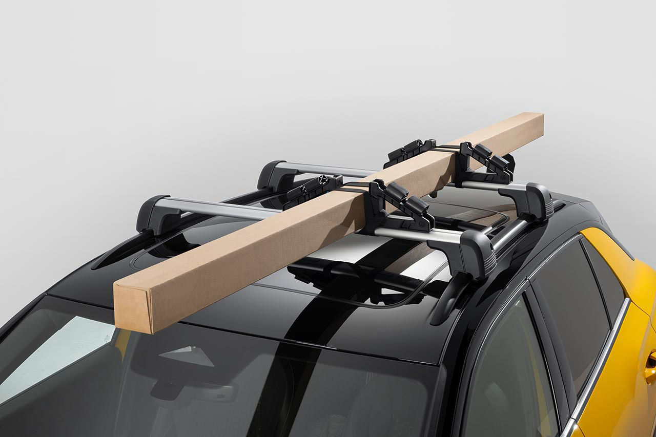 Universal holder for roof attachments
