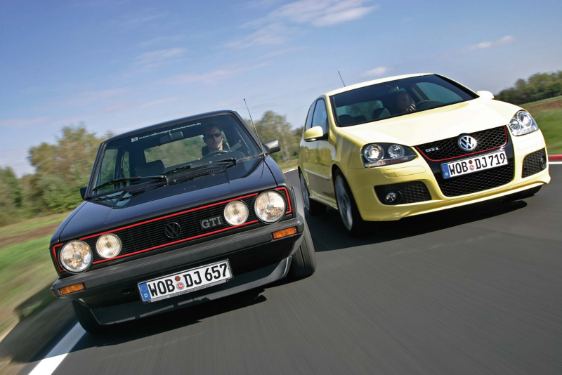 Black and yellow GTI's racing together on a track