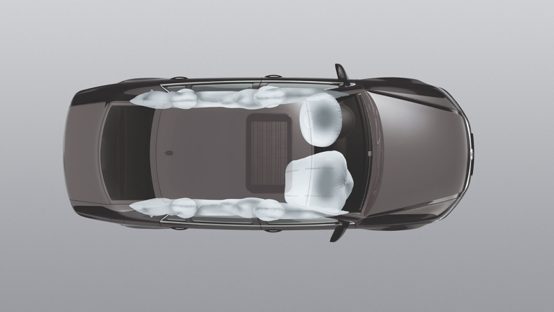 An image displaying a birds-eye view of a car and the airbags inflated