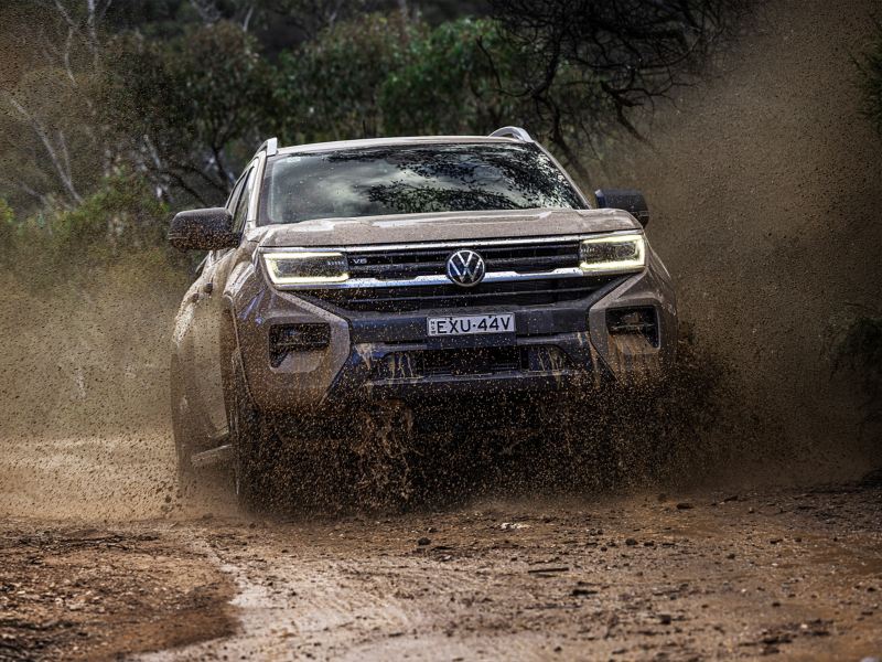 Volkswagen Amarok driving through dirt and mud