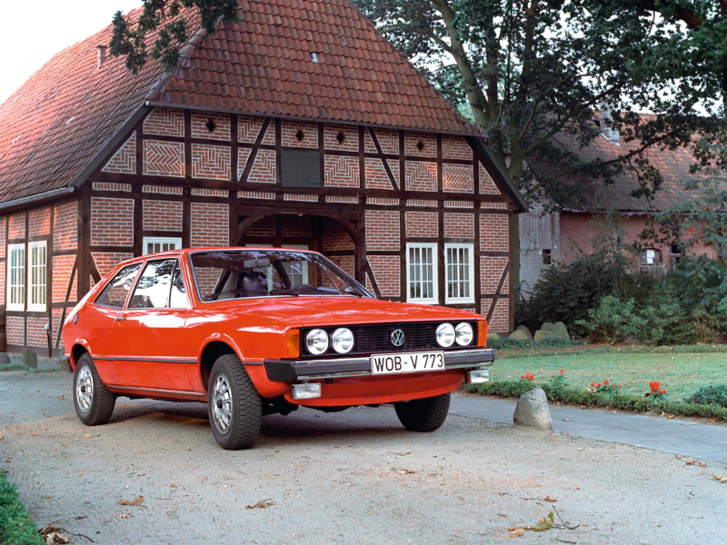 Red VW Scirocco outside a house