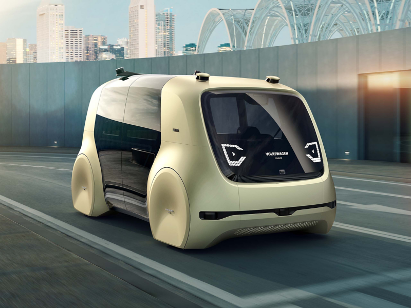 Gold concept car outside building