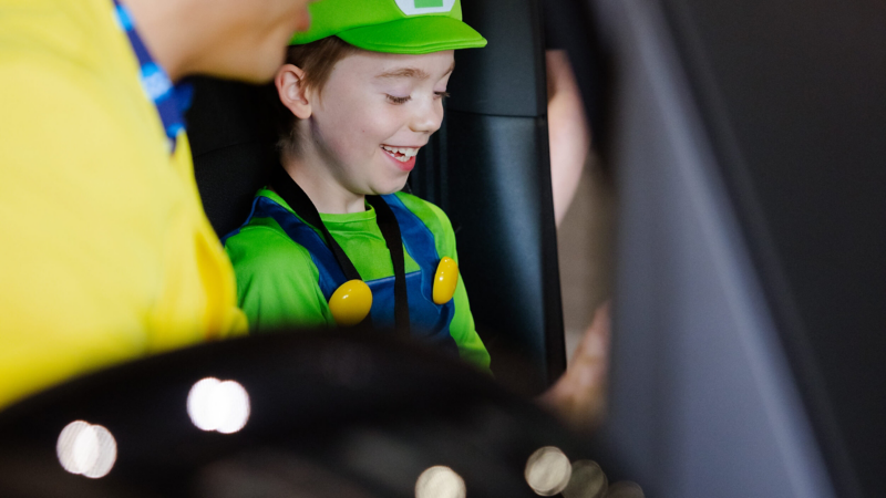 Family playing games inside a Volkswagen ID. Buzz at MCM Comic Con London 2026