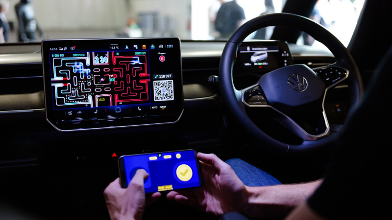 PAC-MAN Championship Edition displayed on the infotainment screen inside a Volkswagen ID. Buzz using AirConsole