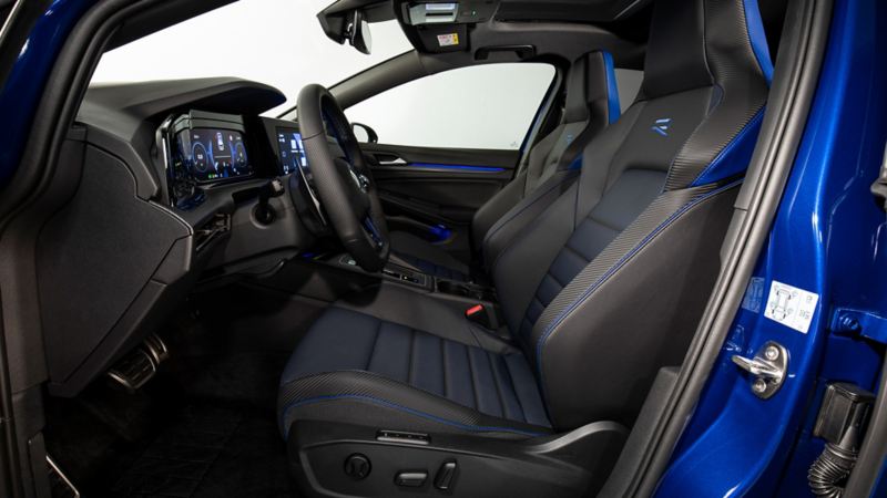 Golf R from inside with sports seats. View through the driver's door.