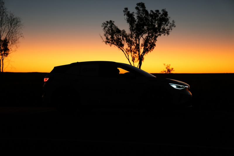 Volkswagen driving in the outback with sun rising