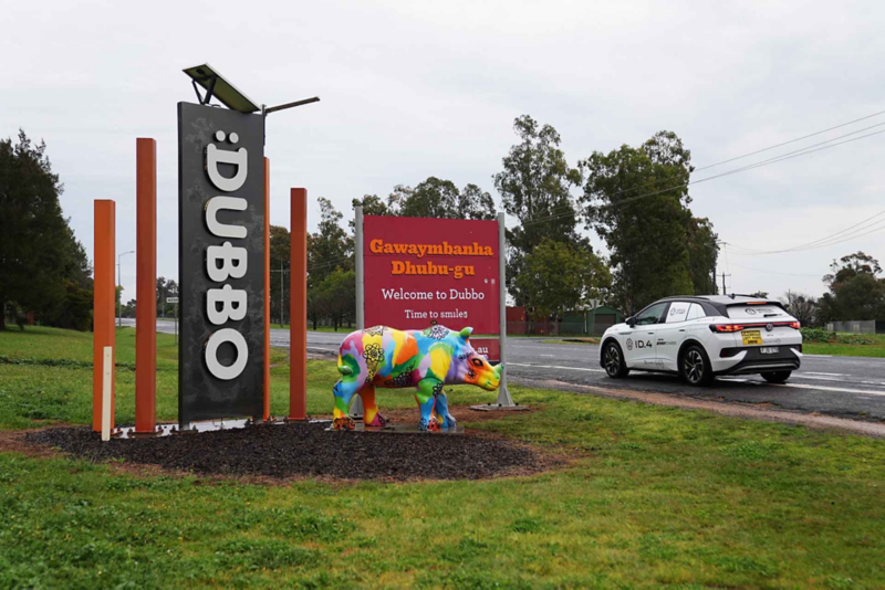 ID.4 driving past Dubbo sign