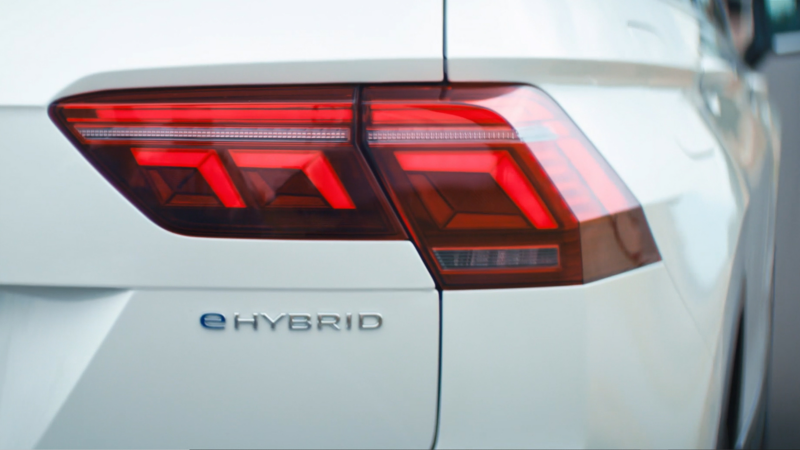 Close up of an eHybrid badge on a white VW car