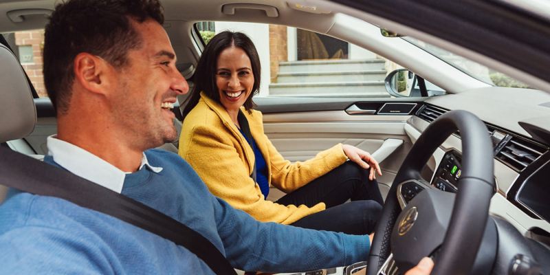  Couples laughing inside the Volkswagen Passat Wagon