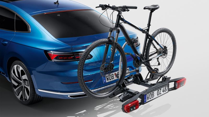 “Basic” bicycle carrier for the ball coupling by VW Accessories on a blue VW Arteon