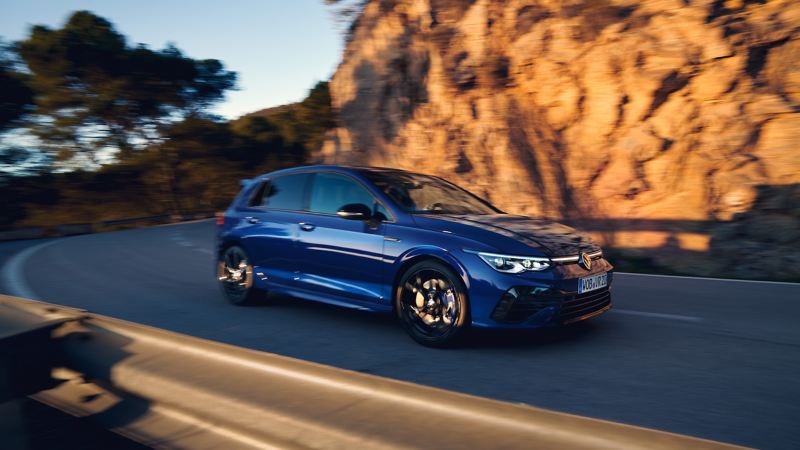 The VWR Golf R “20 Years” in blue drives down a street