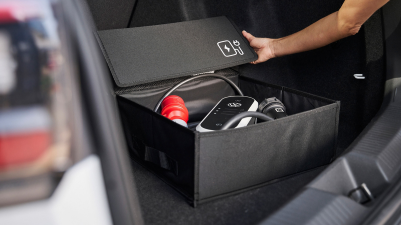 VW Accessories folding box for e-charging cable open in car boot