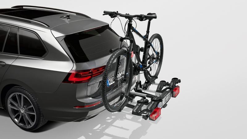 VW Accessories bicycle carrier on a blue VW Golf Variant