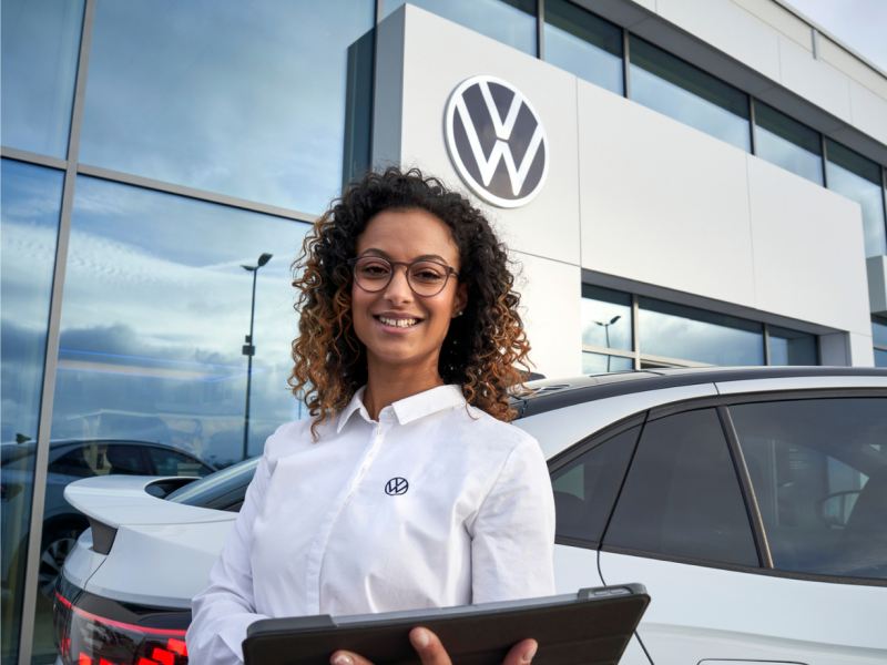 Woman in VW dealership.