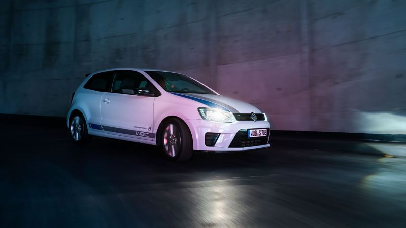 A VW Polo 5 on the road at night