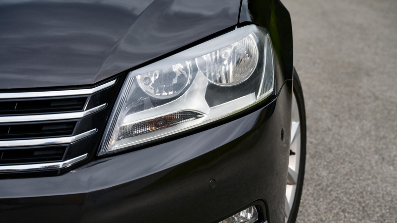 Close-up headlight of a VW Passat B7