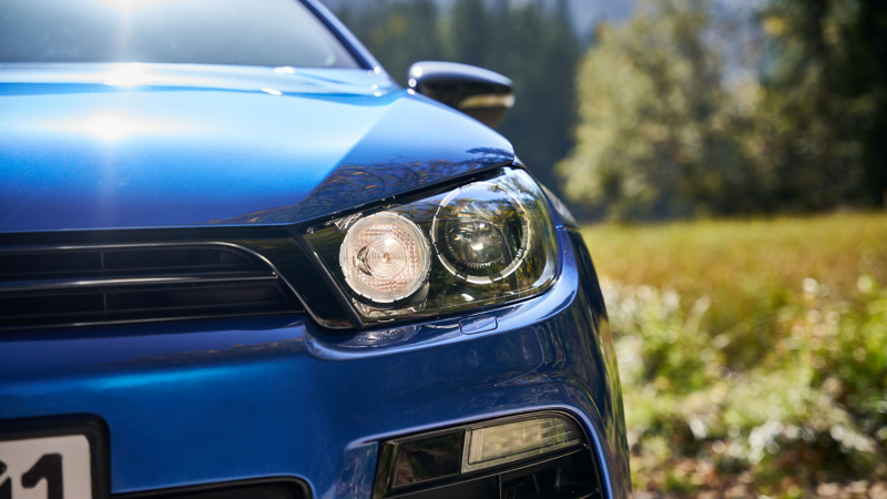Close-up headlight of a VW Scirocco 3