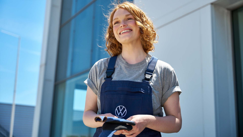 Photo of a smiling VW technician. 