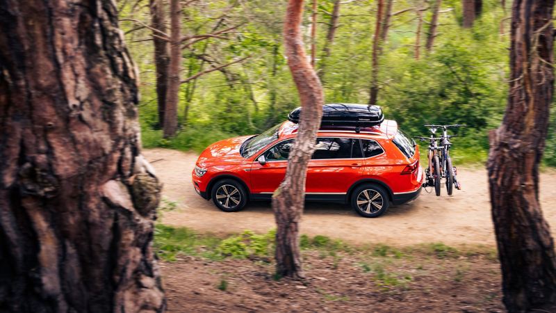 A VW Tiguan on a trip with VW Accessories in nature