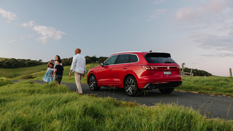 Family having a camping day with a Volkswagen Touareg