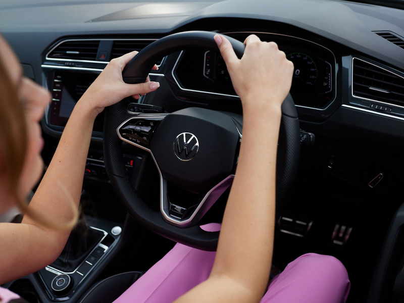 Close up of woman driving car
