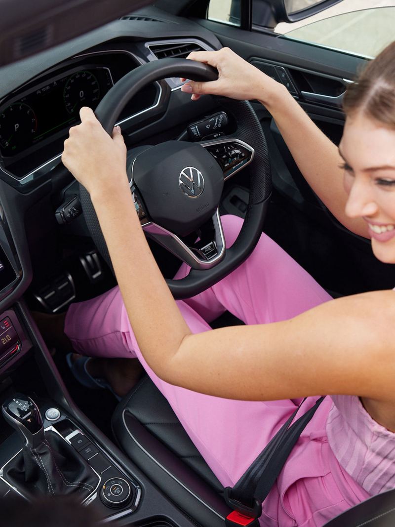Top angle of the Volkswagen Tiguan with woman on driving seat.