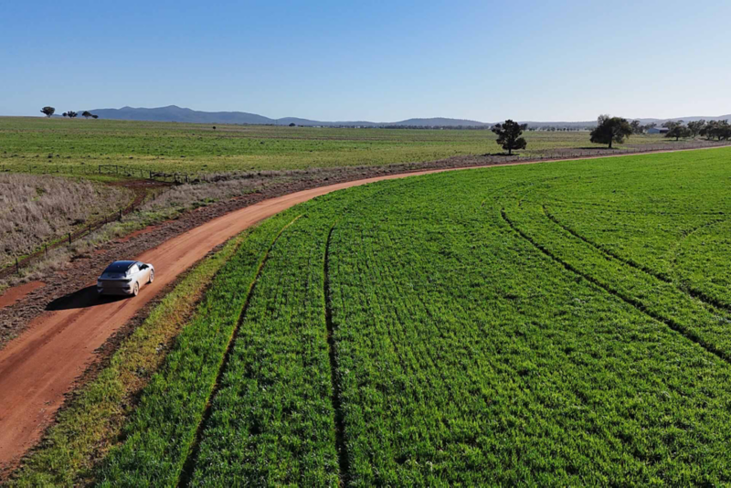 ID.4 driving past farmland