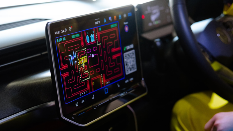 PAC-MAN Championship Edition being played on the infotainment display inside a Volkswagen ID. Buzz