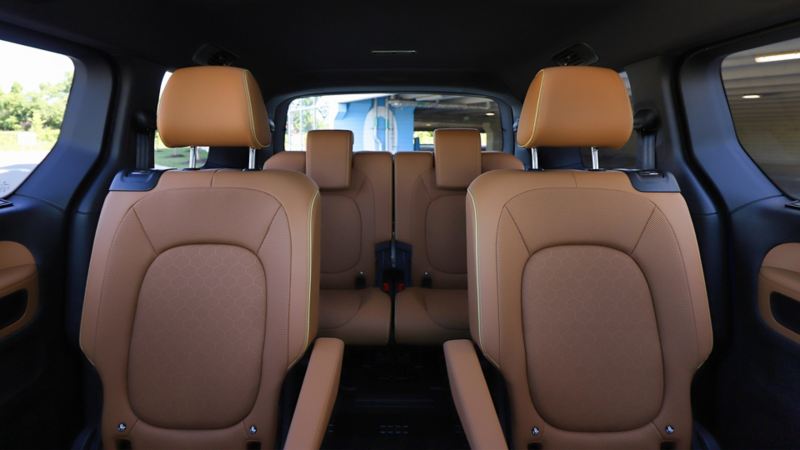 The rear seats of a 2025 ID. Buzz in a brown leather interior.