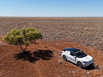 VW car driving through outback