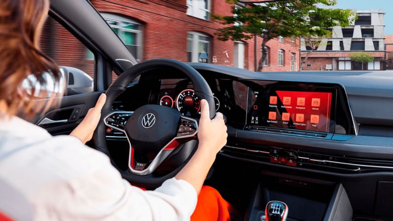 The view of the 2024 Golf GTI dashboard and woman driving