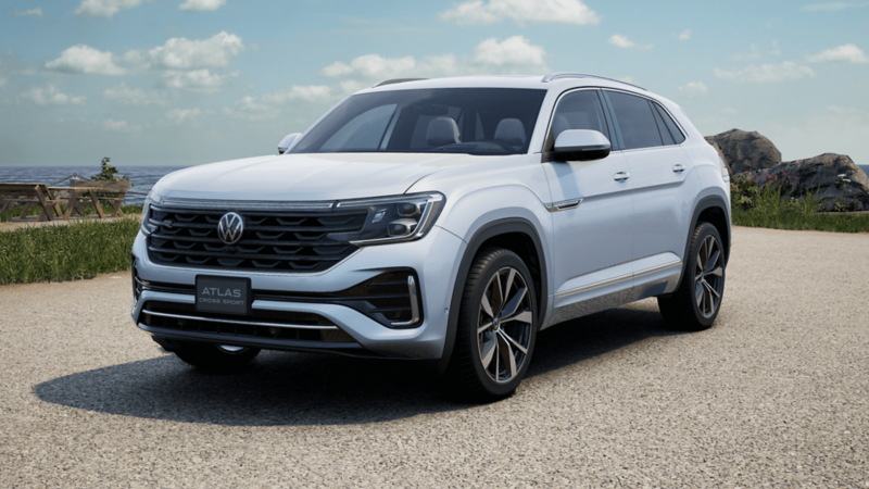 A sleek silver VW Atlas Cross Sport R-Line SUV on a road