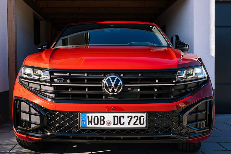 Front view of red Touareg parked in garage