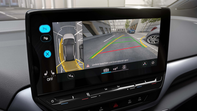 A VW car's infotainment screen showing the Area View 360° camera system, providing a bird's-eye view for parking assistance.