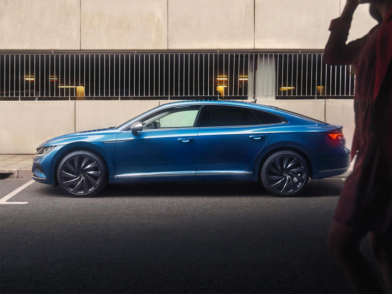 Blue Sedan side view parked