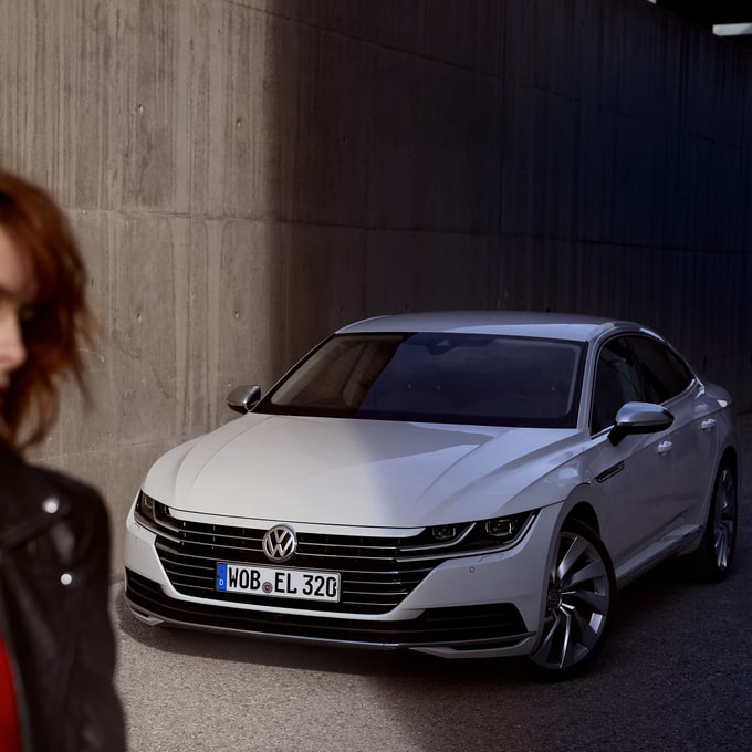 White Arteon parked on a driveway