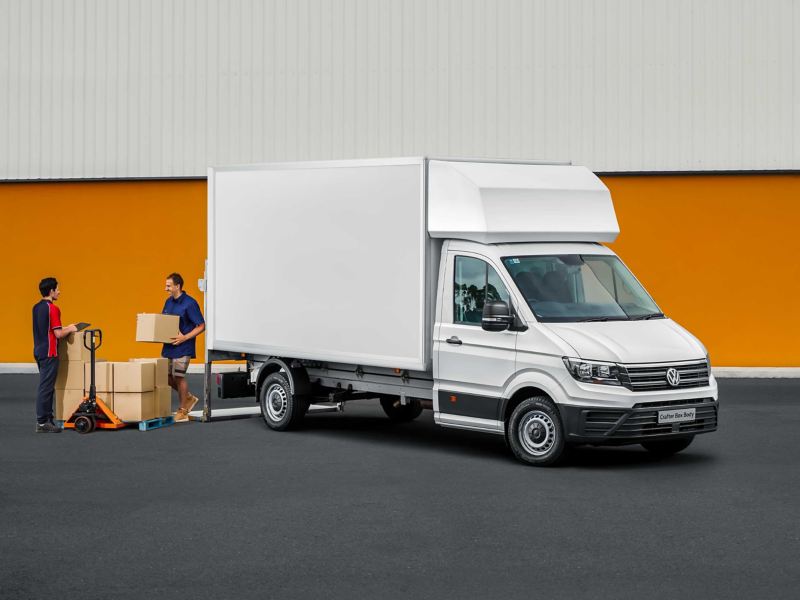 unloading packages from Volkswagen Crafter Box Body.
