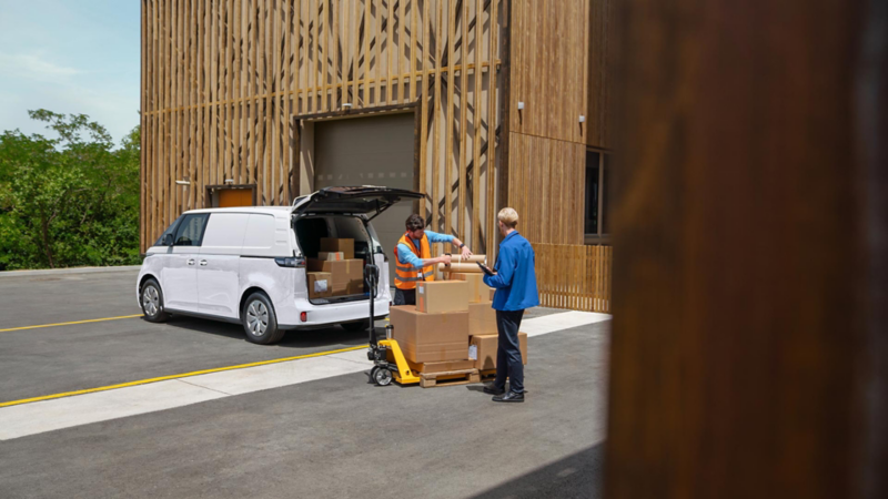 VW ID. Buzz Cargo at work being loaded with boxes