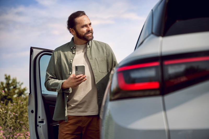 Man standing in car door