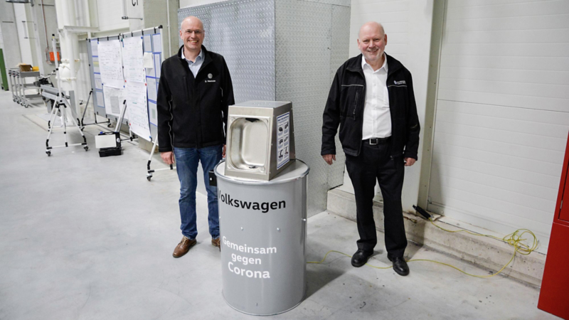 VW employees show disinfectant dispenser