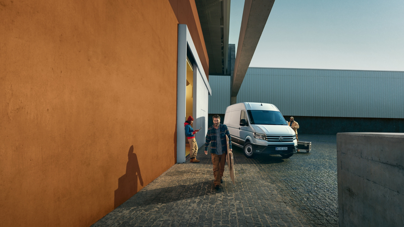Image of man walking in front of  Crafter
