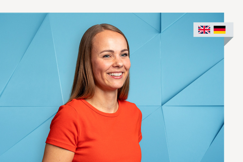 Portrait von Volkswagen Recruiterin Annika, rechts zwei kleine Flaggen: englisch, deutsch