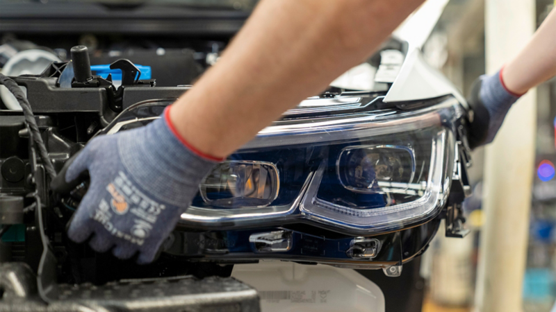 Close-up of assembling a headlight