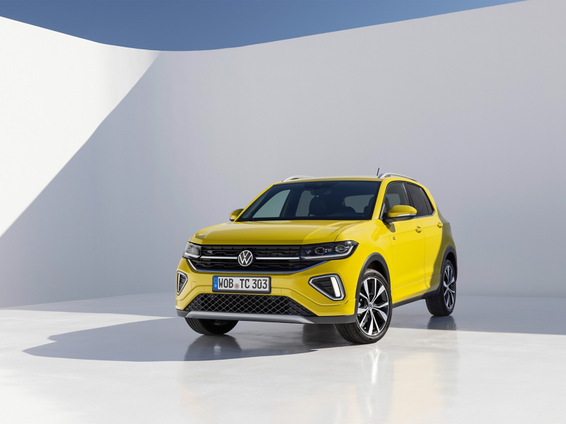 Bold yellow Volkswagen T-Cross front view in clean white studio background—sleek, modern, and ready to stand out.