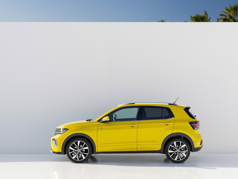 Bold yellow Volkswagen T-Cross side view in clean white studio background—sleek, modern, and ready to stand out.