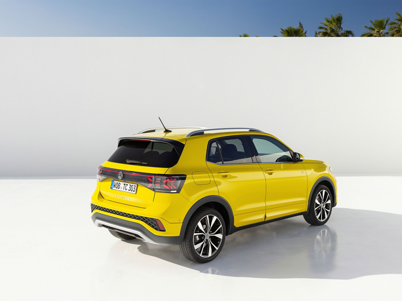Bold yellow Volkswagen T-Cross in clean white studio background—sleek, modern, and ready to stand out.