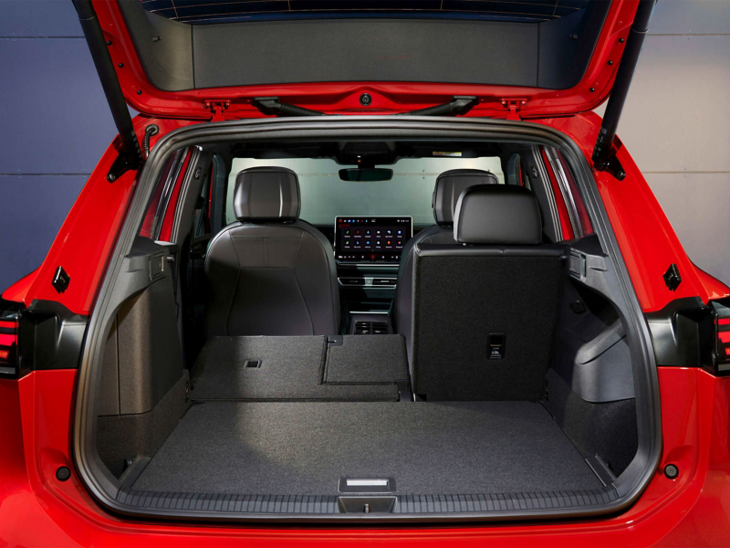 Volkswagen Tiguan Interior. The boot is spacious and well-appointed, with a large infotainment display in the centre console and comfortable-looking seats.